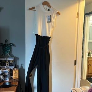 Black/white romper brand new. Size L